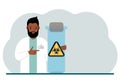 A male doctor or scientist is holding a test tube with a biohazard or virus warning label on it. Biological hazard.