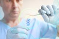 Male doctor, scientist, laboratory assistant, examines hair sample for DNA analysis, concept of innovation in modern science, Royalty Free Stock Photo