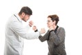 Male doctor and senior female patient fighting with fists