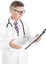 Male Doctor Seriously Reading Medical Records Royalty Free Stock Photo