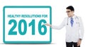 Male doctor show healthy resolutions for 2016 Royalty Free Stock Photo