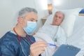 Male doctor showing results to patient Royalty Free Stock Photo