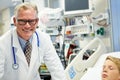 Male Doctor With Sleeping Patient In Emergency Room Royalty Free Stock Photo