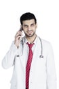 Male doctor speaking on his cellphone Royalty Free Stock Photo