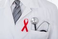 Male Doctor With Stethoscope And Aids Ribbon Royalty Free Stock Photo