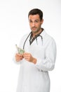 Male doctor with stethoscope while counting money Royalty Free Stock Photo