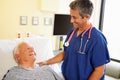 Male Doctor Talking With Senior Male Patient