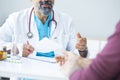 Male doctor talking to patient Royalty Free Stock Photo