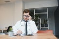 male doctor using tablet computer at his office. General practitioner using digital tablet at his clinic. Royalty Free Stock Photo