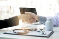 Male doctor in white coat shaking hand to female patient after s Royalty Free Stock Photo