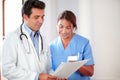 Male doctor working with female nurse Royalty Free Stock Photo