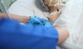 Male doctor working with postoperative female patient in the ICU Royalty Free Stock Photo