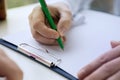 Male doctor writing patient notes on a medical examination or prescription Royalty Free Stock Photo