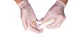 Male doctors hands in rubber gloves holding an ampule of insulin on white backgound isolated. Concept sterility purity