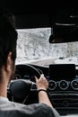 Caucasian male driver details - driving car on the empty road, winter and snow background Royalty Free Stock Photo