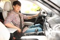 Male driver fastening safety belt