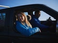 Male driver and female passenger in black car. Royalty Free Stock Photo