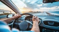 Male Driver Hands on Steering Wheel Driving into Sunset Perspective