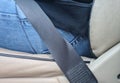 Male driver sits in car with seat belt fastened for safety closeup Royalty Free Stock Photo