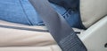 Male driver sits in car with seat belt fastened for safety closeup Royalty Free Stock Photo