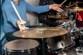 Male drum player hands holding cymbals with both hands and sticks. Drummer Royalty Free Stock Photo