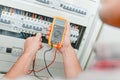 male electrician checking fusebox Royalty Free Stock Photo