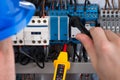 Male Electrician Checking Fusebox Royalty Free Stock Photo