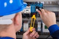 Male Electrician Checking Fusebox Royalty Free Stock Photo