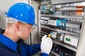 Male Electrician Examining Fusebox Royalty Free Stock Photo