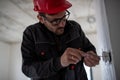 Male electrician installing power socket Royalty Free Stock Photo