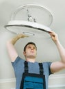 Man mounting LED lamp Royalty Free Stock Photo