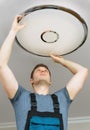 Man mounting LED lamp Royalty Free Stock Photo