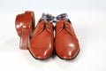 Male elegant brown shoes with belt and bow tie