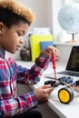 Male Elementary School Pupil Building Robot Car In Science Lesson Royalty Free Stock Photo