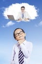 Male elementary student thinks dream job Royalty Free Stock Photo