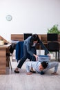 Male employee doing sport exercises in the office Royalty Free Stock Photo