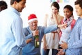 Too much of a good thing. A male employee having too much fun at the office party while his colleagues look on. Royalty Free Stock Photo