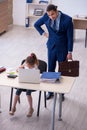 Young male employee and his little girl in the office Royalty Free Stock Photo