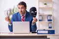 Male employee with mask in hipocrisy concept Royalty Free Stock Photo