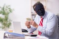 Male employee with mask in hipocrisy concept Royalty Free Stock Photo
