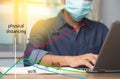 Male employee wearing a health mask Preventing corona virus infection covid-19, reading social distancing or physical distancing