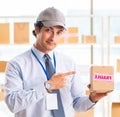 Male employee working in box delivery relocation service