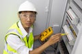 Male engineer checking electrical system with electronic equipment Royalty Free Stock Photo