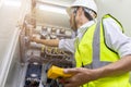 Male engineer checking electrical system with electronic equipment Royalty Free Stock Photo
