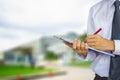 Male engineer inspection checking in factory With note on notepad or industry blurred background.Metaphor Quality inspection or P