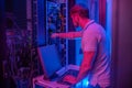 Male engineer in server room near computer Royalty Free Stock Photo