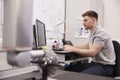 Male Engineer Uses CMM Coordinate Measuring Machine In Factory