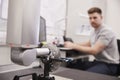 Male Engineer Uses CMM Coordinate Measuring Machine In Factory