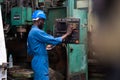 Male Engineer Working on digital tablet in Factory. black male engineer checking Quality control the condition of the machine