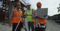 Male engineers discussing plan on construction site Royalty Free Stock Photo